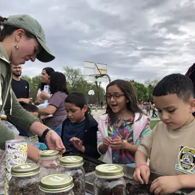 kids making native plant seed balls