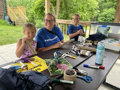 Family enjoying crafts at Nature Play Day program at the EEC