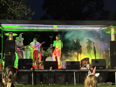 That Homegrown Halloween Show playing on stage at Haunted Walk event at night