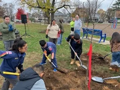 Kids planting a tree at Roosevelt Park