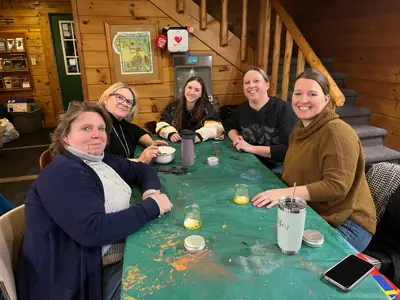 Group making lip balm at program at EEC
