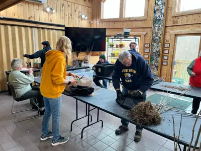 Volunteers preparing trees for Earth Day tree giveaway