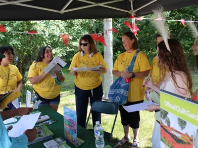 Volunteers judging activities at Pollinator Promenade event at EEC