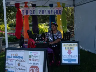 Face painting booth at Waggin' in the Woods event