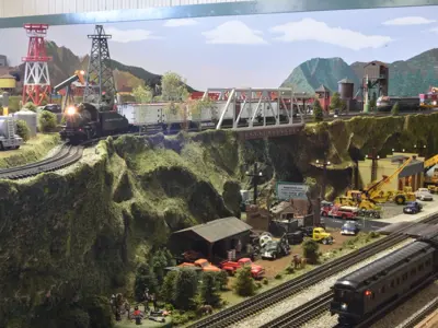 A photo of the two tiers of the O-gauge model train layout at the NNYCRRM 