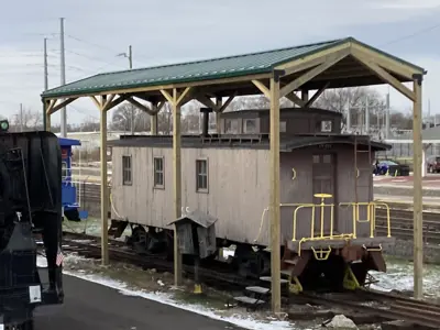 The wooden caboose at the NNYCRRM with its newly installed roof. 